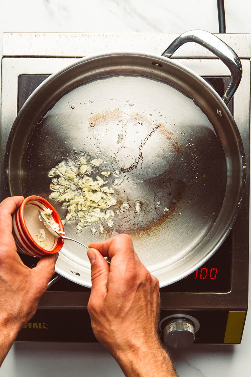 frying garlic in pan