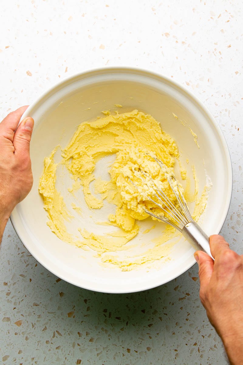 whisking butter and sugar together