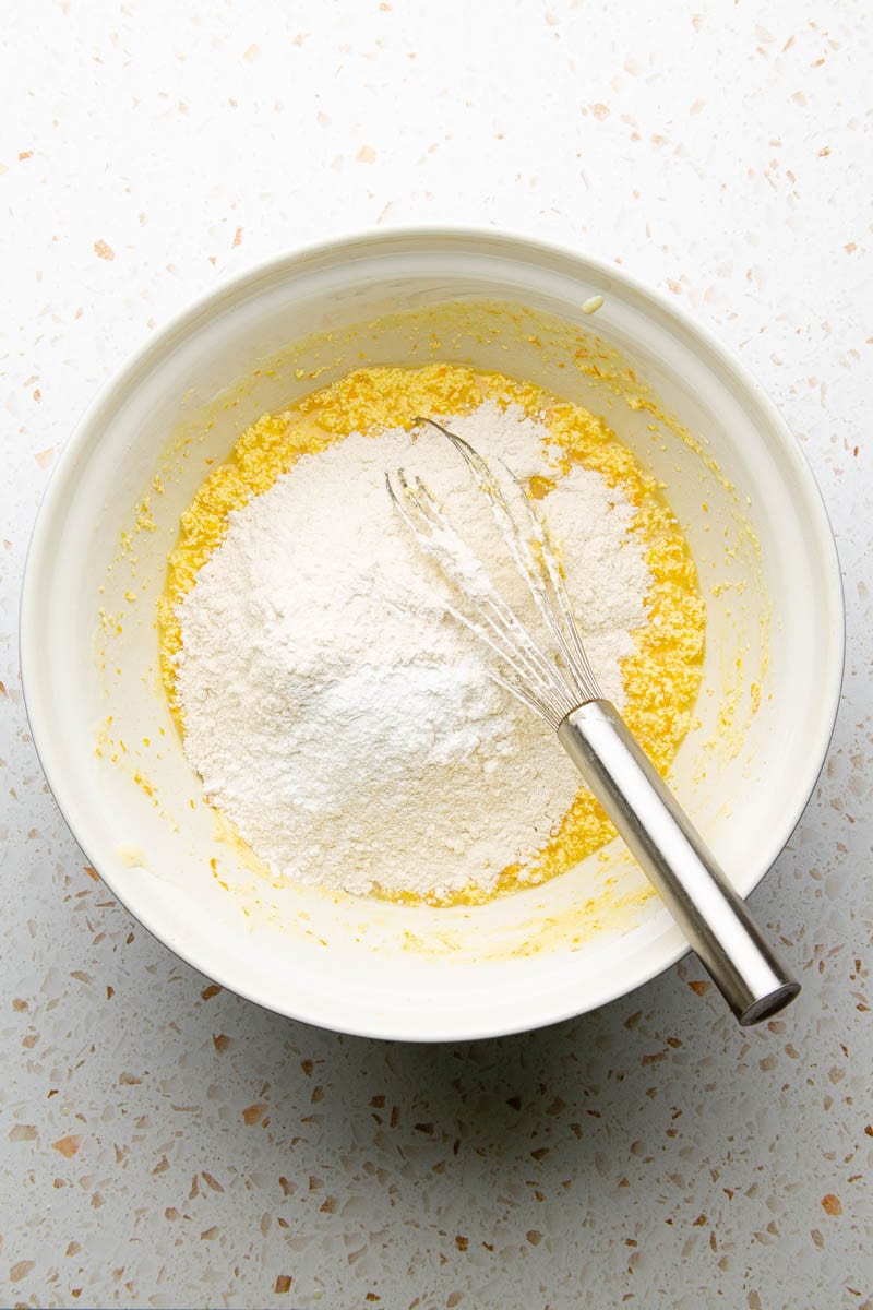 flour into wet ingredients for orange cake