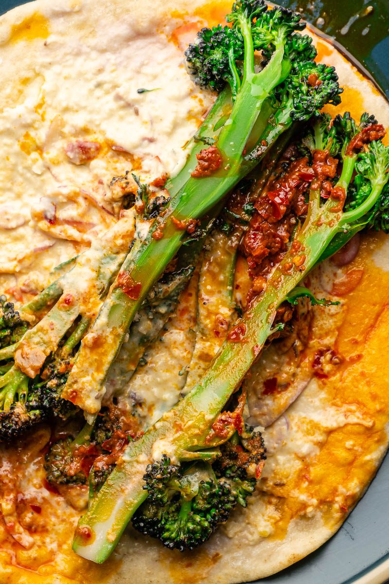 broccoli wraps close up with hummus and harissa